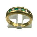An 18ct yellow gold emerald and diamond ring, channel set with three diamonds and three emeralds, (