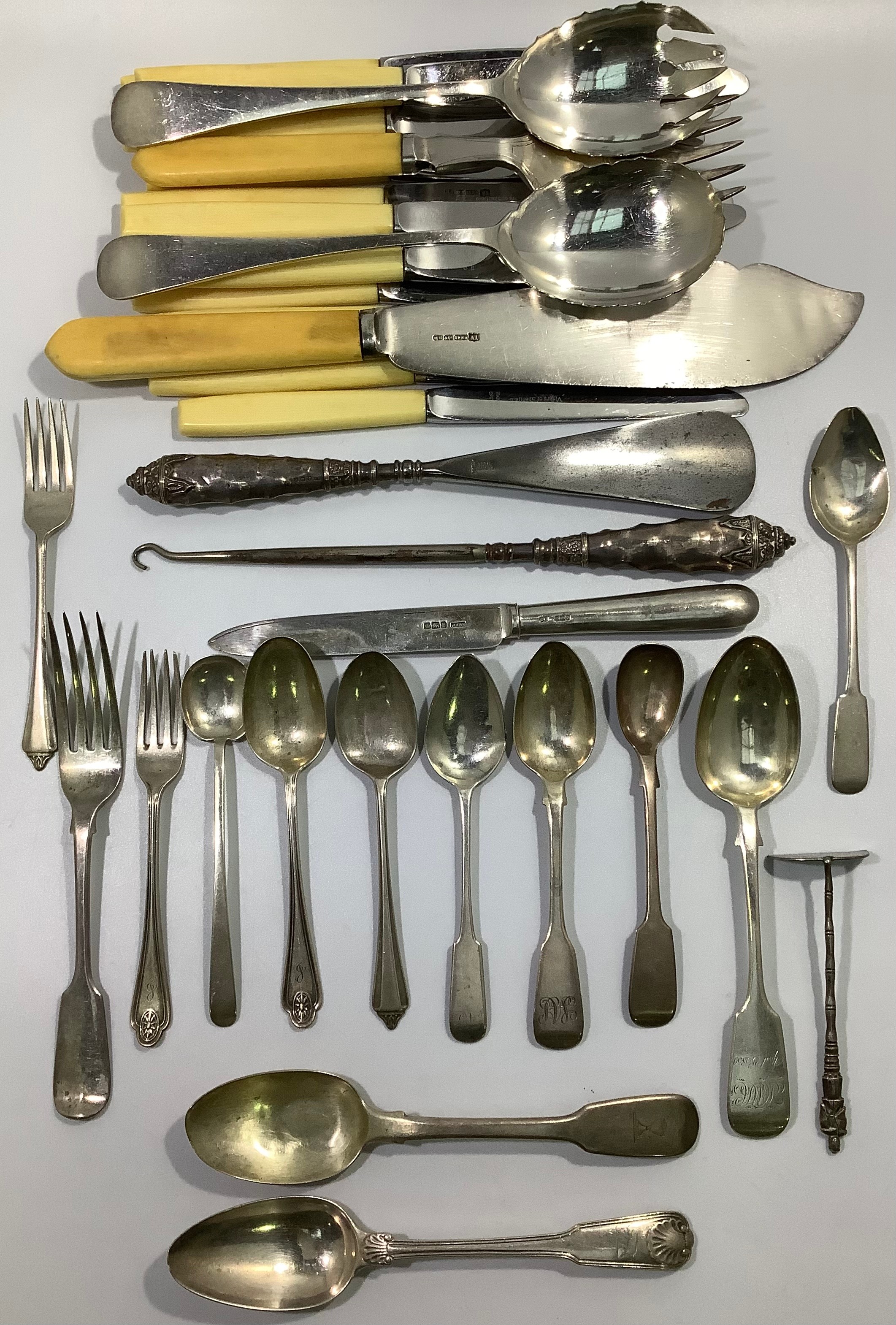 A mixed collection of assorted Georgian, Victorian and later silver flatware including spoons and