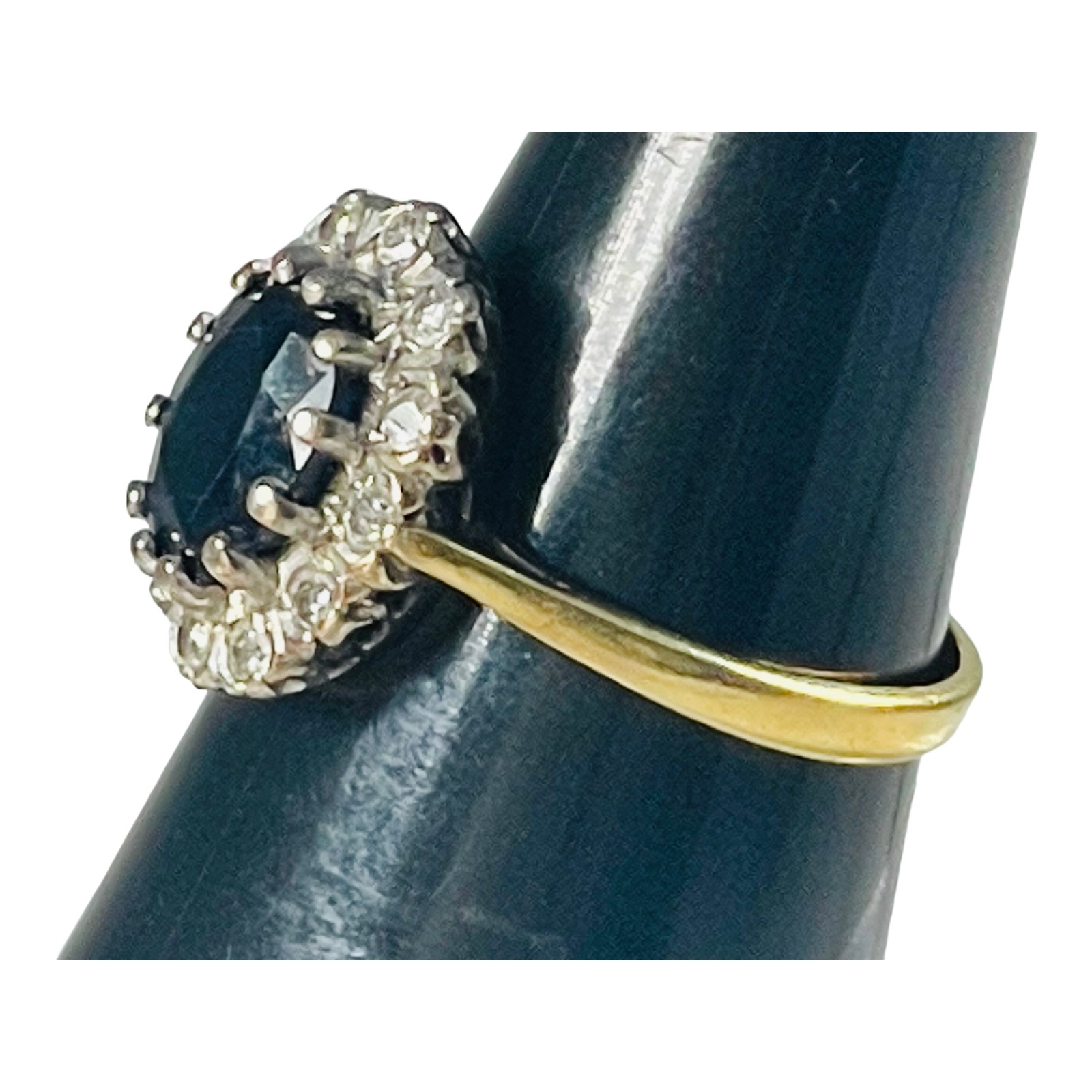 An 18ct yellow gold sapphire and diamond dress ring, set with an oval shaped sapphire to the centre, - Image 4 of 5