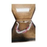 A large quantity of silver and costume jewels, including a grey and black ceramic necklace, pink and