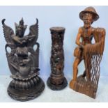 Three various large Oriental hardwood carved figures including a fisherman with net, a deity and a