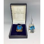 An 18ct gold ring, centrally four-claw set with a large round faceted blue topaz, together with a