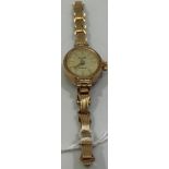 A ladies 9ct gold Everite quartz wristwatch, the silvered dial with batons denoting hours, on 9ct