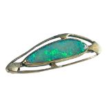 A 9ct yellow gold brooch, set with a large misshapen opal to the centre, weighs 4.3 grams.