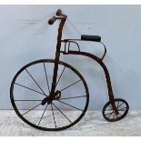 A child’s Penny Farthing with metal handles, frame and wheels, in unrestored condition, height to