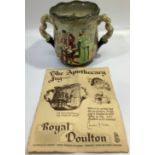 A Royal Doulton twin-handled jug / loving cup decorated as 'The Apothecary' designed by Charles