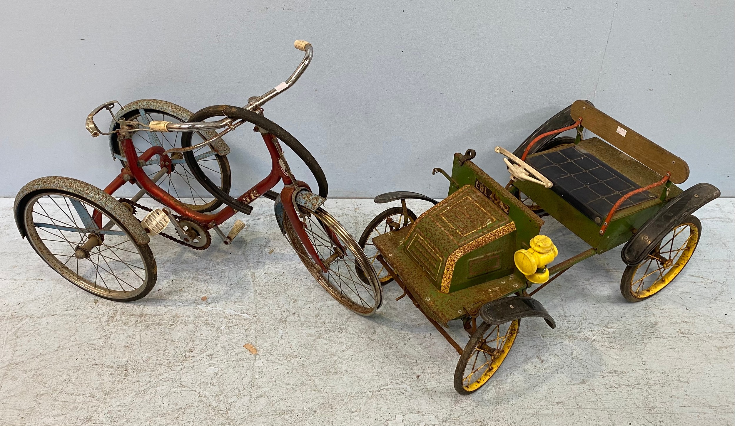 A mid-20th century Triang tin-plate pedal car, registration LBL 4242, painted in green with yellow