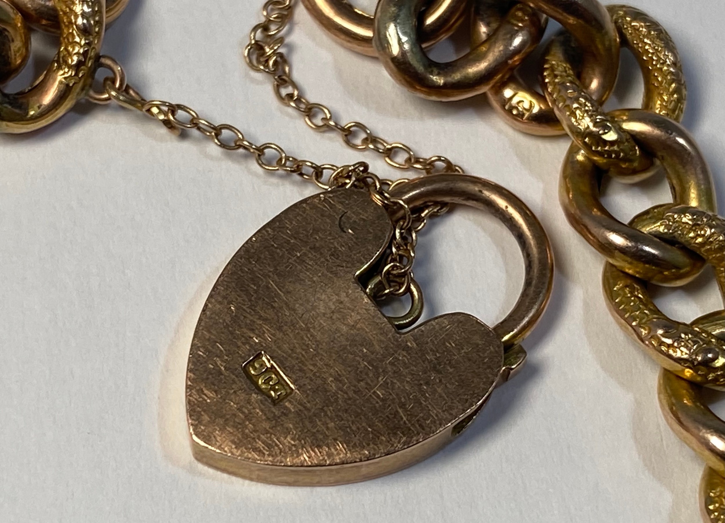 A 9ct gold curb link bracelet with heart-shaped padlock and safety chain, gross weight approximately - Image 2 of 2