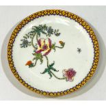 A Chinese porcelain famille rose dish, decorated with incised yellow and rose-painted flowers within