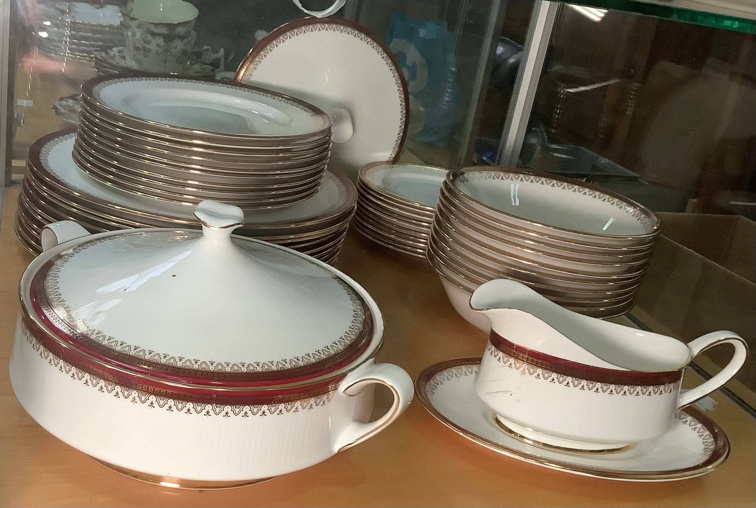 A Paragon ‘Holyrood’ pattern part tea and dinner service with red and gilt rims comprising one
