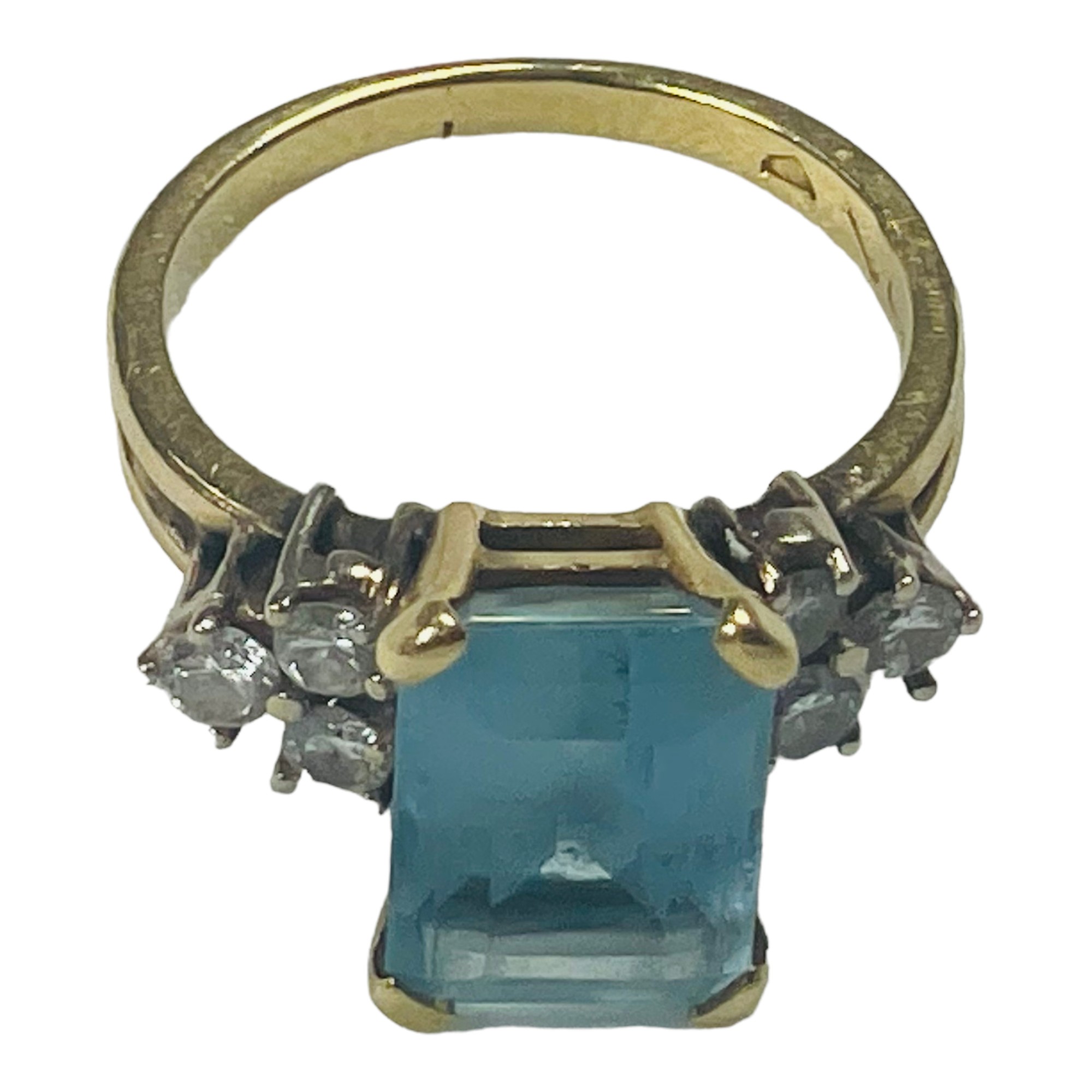 An 18ct gold dress ring, set with a large rectangular shaped aquamarine to the centre, with three