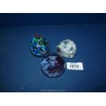 Two white Caithness paperweights, a Murano Vetreria Fiori paperweight, etc.