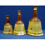 A trio of Wade Bell's Old Scotch Whisky decanters: one small (empty),