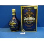 A boxed 'Single Malt Glenfiddich aged 18 years Scotch Whisky' decanter (blue box).