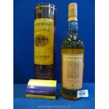 A bottle of Glenmorangie 10 year old Single Highland Malt Scotch Whisky, in presentation tin.