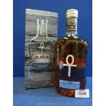A boxed bottle of Jura Single Malt Scotch Whisky, lightly peated with hints of smoke and spice.