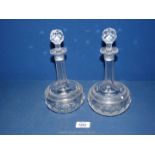 A pair of cut glass and etched, globular Decanters,
