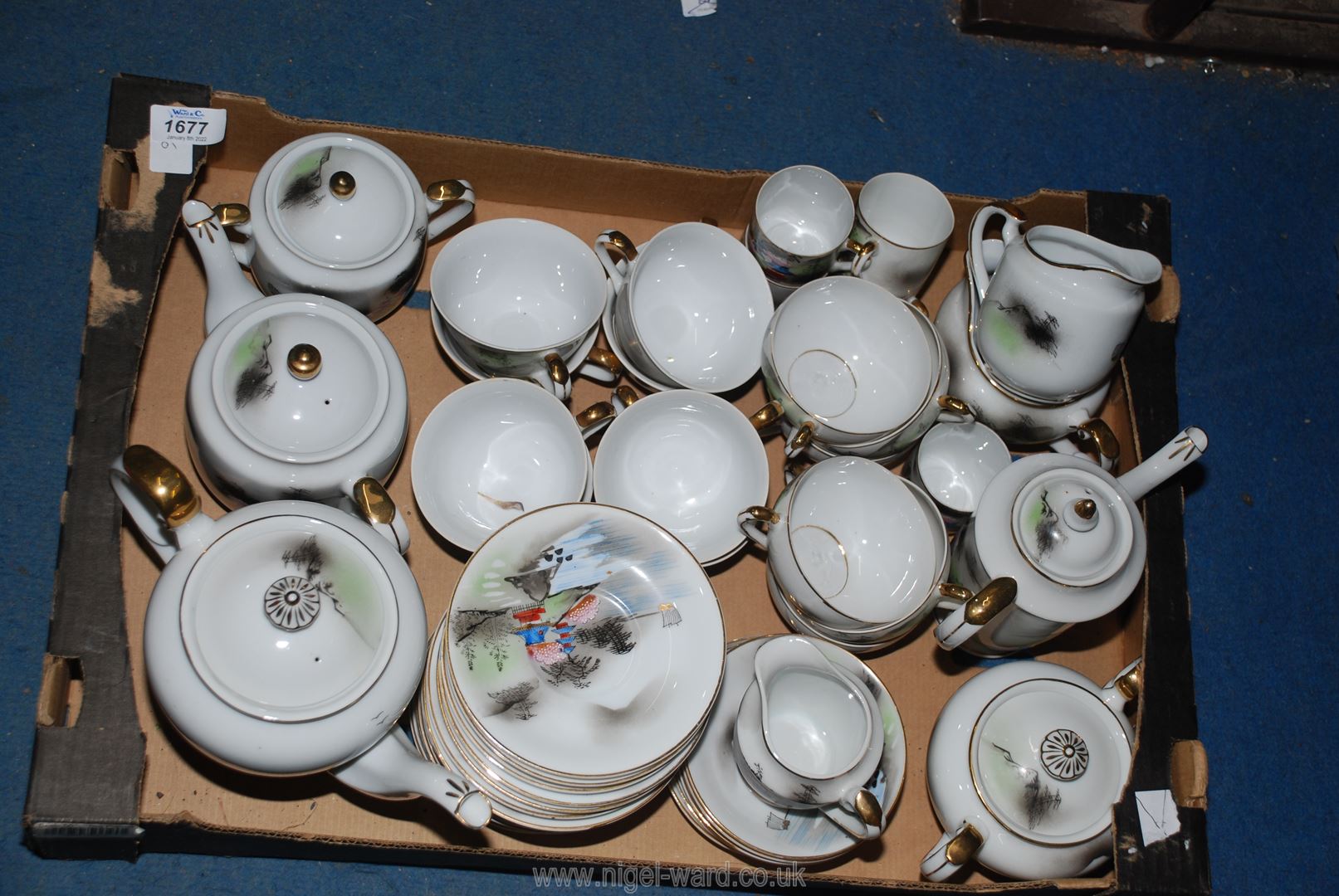 A large quantity of an Oriental Teaset comprising of teapots, coffee pots, cups/saucers,