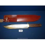 A large Bowie knife with sheath. Made in Sheffield by J.