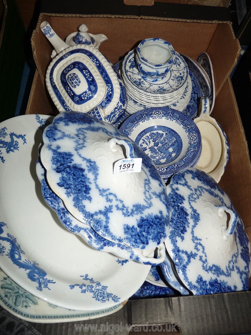 A good quantity of mixed blue and white china including vegetable dishes with lids, meat plate,