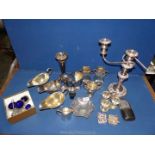 A box of mixed plated items including a three branch candelabra, three sauce boats,