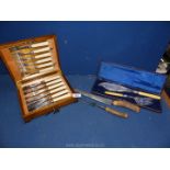 A pair of Mappin & Webb fish servers, cased epns fish eaters and a carving knife & fork.