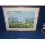 A framed and mounted Watercolour depicting barns, fields and rolling hills in the distance,