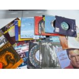 A quantity of 45 RPM records to include Elvis, The Move, Racey etc.