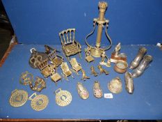 A quantity of brass including horse brasses on straps, rocking chairs, brass miner,