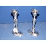 A pair of silver plated English Regency style oval Candlesticks with detachable sconces, 8" tall.