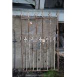 A heavy metal pedestrian gate with arrow head tops 31" x 53".