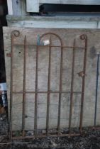 A heavy metal garden gate with spike tops 33" x 46".