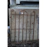 A heavy metal garden gate with spike tops 33" x 46".