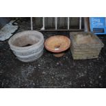 Two concrete planters and terracotta style bird bath.