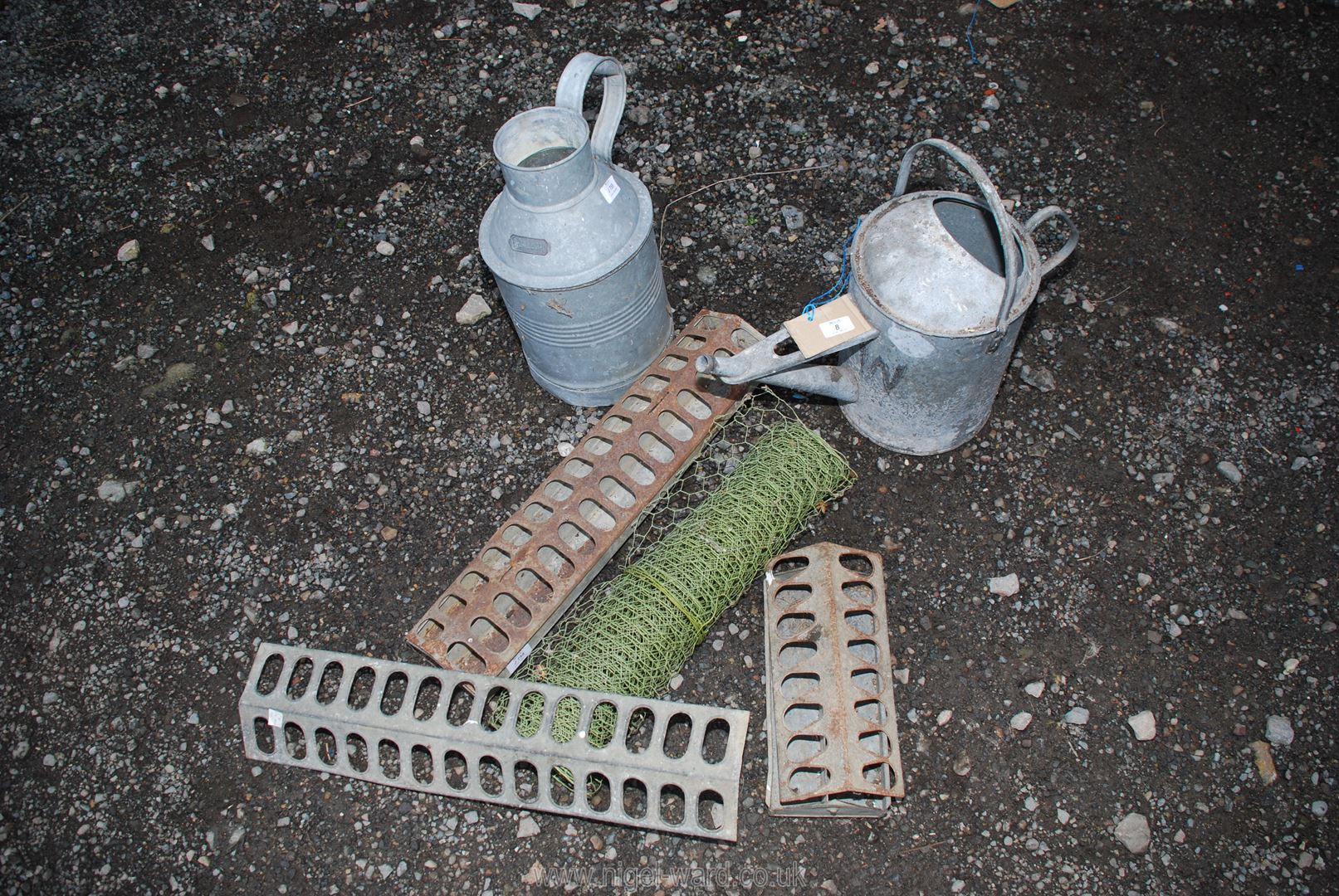 A quantity of chicken feeders, watering can, galvanised water carrier and wire.