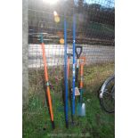 Quantity of garden tools including rake, hoes, spade,