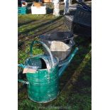Two gallon watering can and a galvanized pitch bucket.