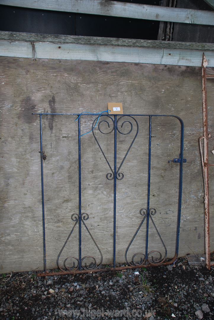 A metal garden gate 33" x 37".