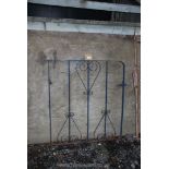 A metal garden gate 33" x 37".