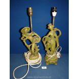 A pair of green composite oriental figure lamps depicting Geisha and farmer.