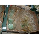 A box of mixed glass including green stemmed glasses, very fine champagne flutes,