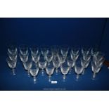 A large quantity of wine glasses, eight having a blue tinge to them and signed Anno 1859 to base.