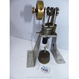 A model of a vertical cylinder Hot Air/Sterling cycle stationary Engine on aluminium plate supports,