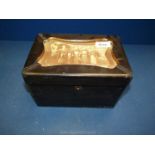 A small ebonised Tea Caddy decorated with a black and white scene of an oriental family,