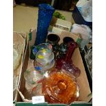 A quantity of coloured glass to include carnival glass, two black floral embossed vases etc.
