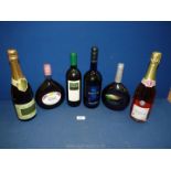 A quantity of bottles including Mateus Rose, Rhone Valley white wine, Champagne Brut,