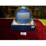 A Silver circular photograph frame, Birmingham 1990, makers Broadway & Co., boxed.