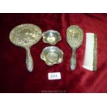 A plated dressing table set including brush, comb, hand mirror and two plated dishes.