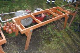 A wooden folding table base
