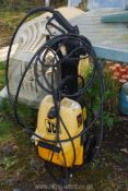 A JCB pressure washer. (motor ran at time of cataloguing).